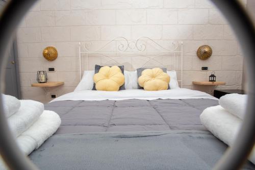 a bedroom with a large bed with two pillows at L'Accademia dei Sogni in Sassari