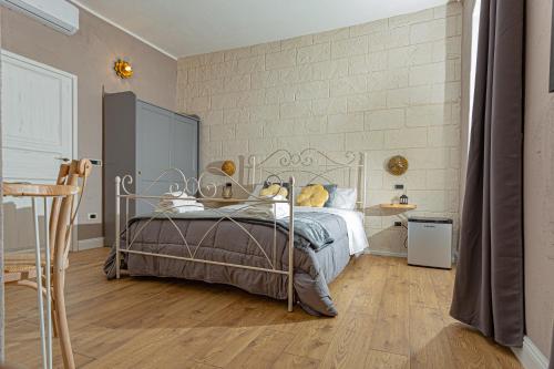 a bedroom with a bed with a metal frame at L'Accademia dei Sogni in Sassari
