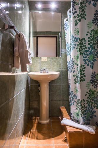 a bathroom with a sink and a shower at The Palms At Coco Beach in Coco