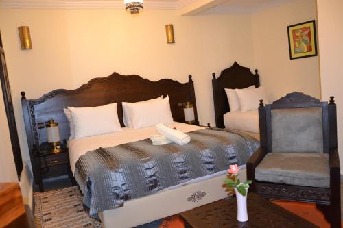 Postel nebo postele na pokoji v ubytování Hotel Riad Ben Atar