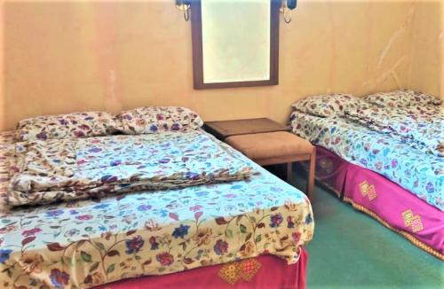 Ένα ή περισσότερα κρεβάτια σε δωμάτιο στο Villa Lembang Bunda