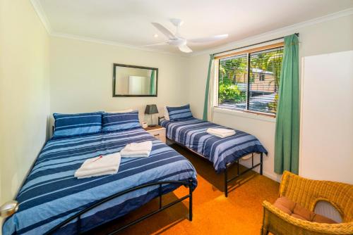 Postel nebo postele na pokoji v ubytování Safety Beach Ocean Bungalows