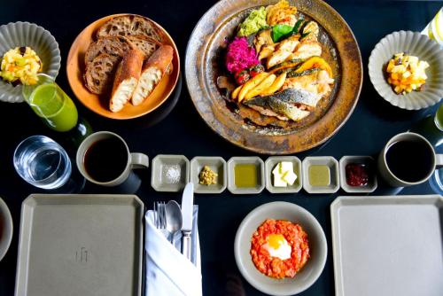 a table with plates of food and bowls of food at MOGANA in Kyoto