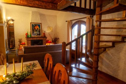 a living room with a couch and a stairway at Quinta Forum in Tocha