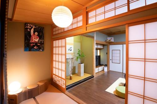 a japanese home with an open floor plan at Tsugumian in Kanazawa
