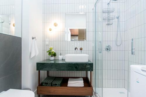 a bathroom with a sink and a shower at Apartament 54 Old Town in Gdańsk