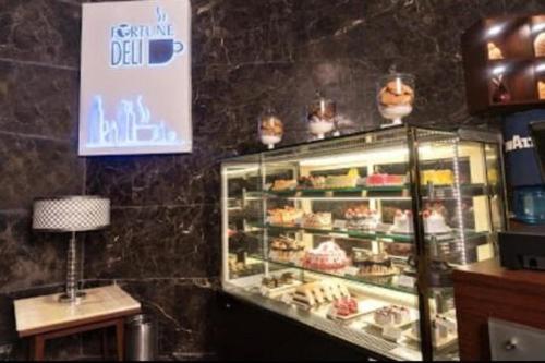 a bakery with a display case full of pastries at Fortune Park Sishmo, Bhubaneswar - Member ITC Hotels' Group in Bhubaneshwar