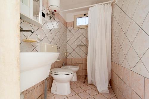 Ванная комната в Villa Aurora By Cala Salento