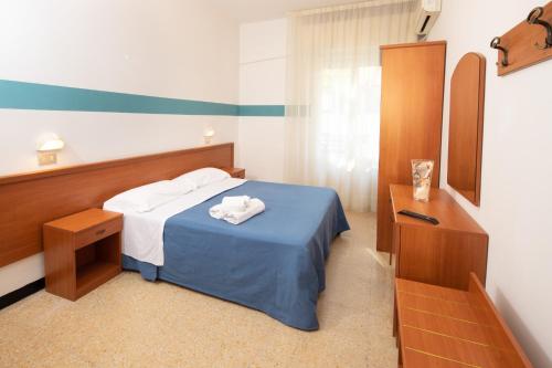 Giường trong phòng chung tại B&B Italia