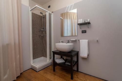 a bathroom with a sink and a shower at Principi di Piemonte Sestriere in Sestriere
