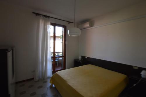 Postel nebo postele na pokoji v ubytování Casavacanze Zeus