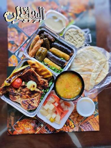 a group of different types of food on a table at Jewel Gameel appartement in Port Said