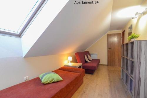 מיטה או מיטות בחדר ב-Apartamenty Rybacka 84B m34