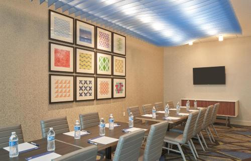 a conference room with a long table and chairs at Holiday Inn Express Doral Miami by IHG in Doral