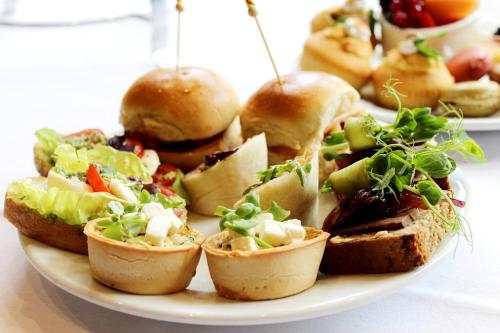 a plate of food with sandwiches and vegetables on it at Abbey Court in Nenagh