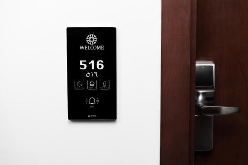 a clock on the side of a door at Landmark Hotel & Suites فندق وأجنحة لاندمارك in Jeddah