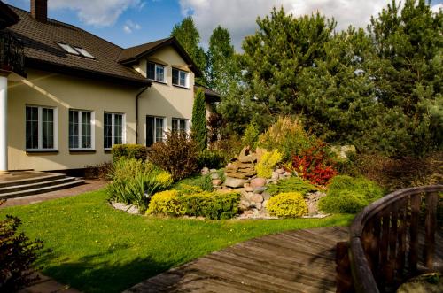 a garden in front of a house at Dworek Jolanta in Biała Podlaska