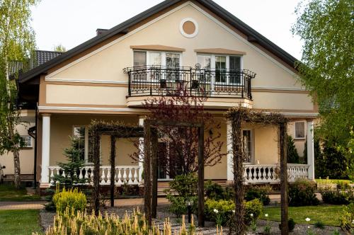 a house with a gate in front of it at Dworek Jolanta in Biała Podlaska