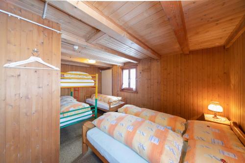 En eller flere senge i et værelse på Berghotel Gaffia