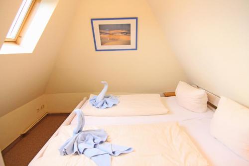 En eller flere senge i et værelse på Ferienwohnung Humboldt
