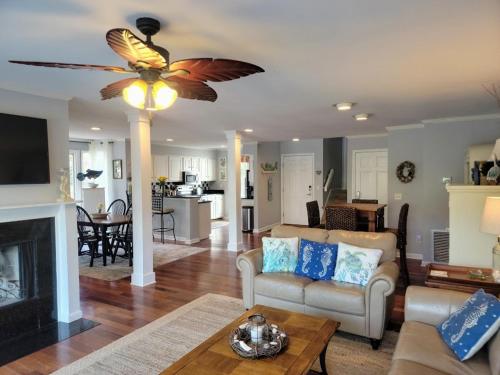 a living room with a couch and a ceiling fan at Elegant 3 BR 3 BA Wild Dunes Gated Resort Villa with 2 Golf Courses, Beach and Pool in Isle of Palms