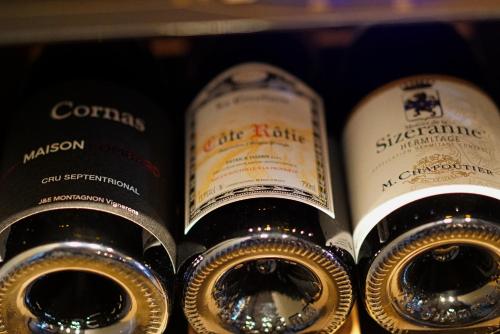 a bunch of bottles of wine on a shelf at Mercure Valence in Valence