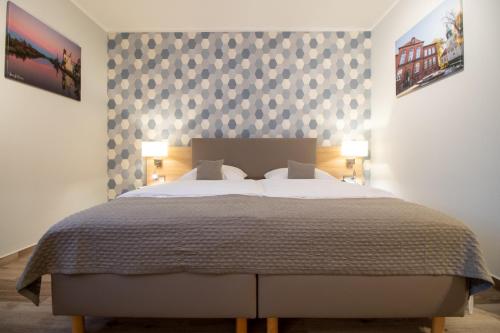 Postel nebo postele na pokoji v ubytování Hotel Fallersleber Spieker