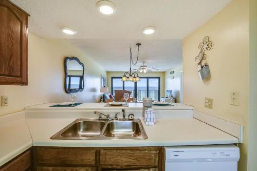 a kitchen with a sink and a counter at Commodore Resort #707 by Book That Condo in Panama City Beach