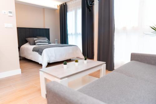 Katil atau katil-katil dalam bilik di Apartamentos Kai