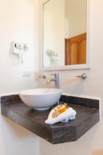 a bathroom counter with a sink and a bowl at HOTEL & BEACH CLUB OJO DE AGUA in Puerto Morelos