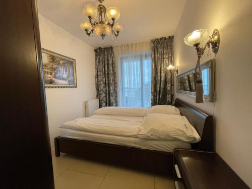 Ένα ή περισσότερα κρεβάτια σε δωμάτιο στο Wolin-Travel- Promenada Gwiazd 28