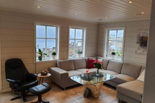 a living room with a couch and a table at Flohytta in Stryn