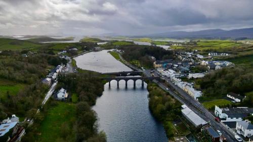 an aerial view of a city with a bridge over a river at Corner House in Newport