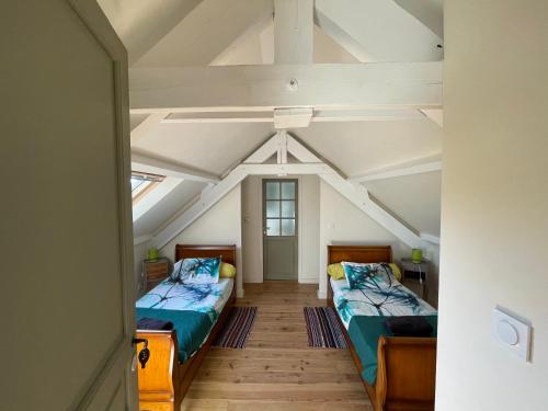 a room with two beds in a attic at Riverview in Bohal