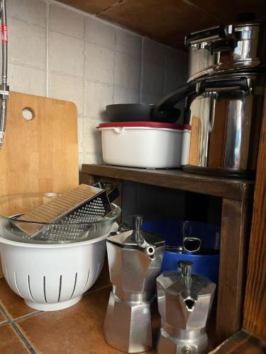 a kitchen with a counter with a sink and some pans at Casa Arrantzale II in El Cercado