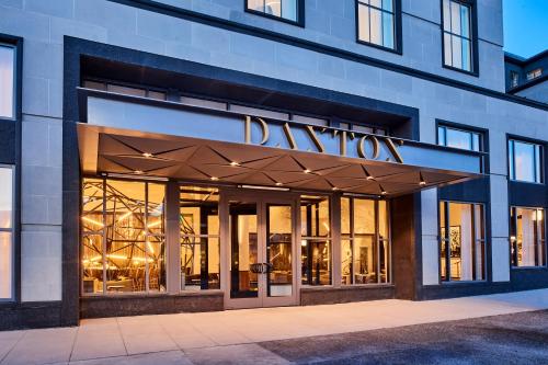 a store front of a building with a sign on it at Daxton Hotel Birmingham, Curio Collection by Hilton in Birmingham