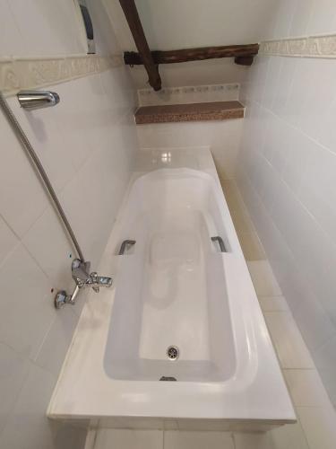 a bathroom with a white sink in a room at Patio de Piedra Hotel Boutique in La Paz