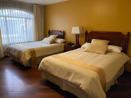 Ένα ή περισσότερα κρεβάτια σε δωμάτιο στο Hotel Spa Casa Real