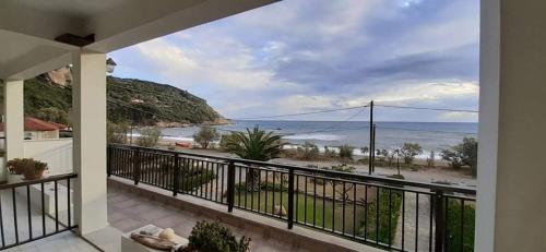 a balcony with a view of the beach at Olga Paltsi Rooms in Paltsi Pilion