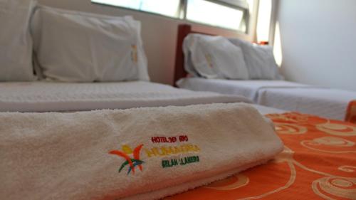 Postel nebo postele na pokoji v ubytování Hotel Rio Humadea