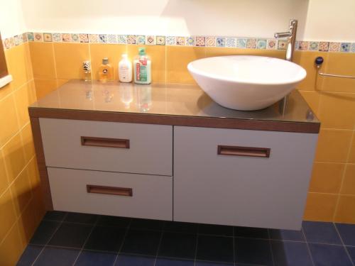 a bathroom with a sink and a bowl on a counter at B&B Verdeblu in Valderice