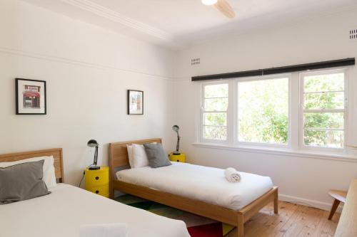 A bed or beds in a room at Katoomba Falls Cottage