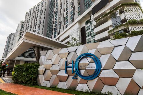 a sign for the olympics is in front of a building at H20 Residence Ara Damansara by Airhost in Petaling Jaya