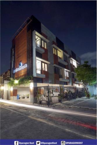 a building on the side of a street at night at DPARAGON KEMUNING in Yogyakarta