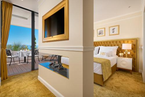a hotel room with a bed and a fireplace at Hotel Villa Harmony in Split