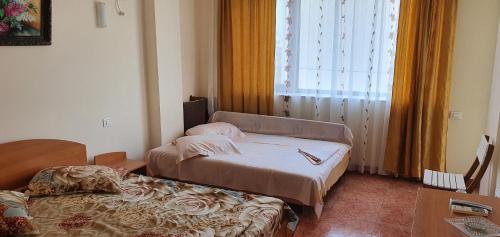 a hospital room with two beds and a window at Vila Raduinea in Eforie Nord