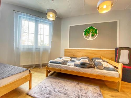 Postel nebo postele na pokoji v ubytování Apartamenty Paszkówka