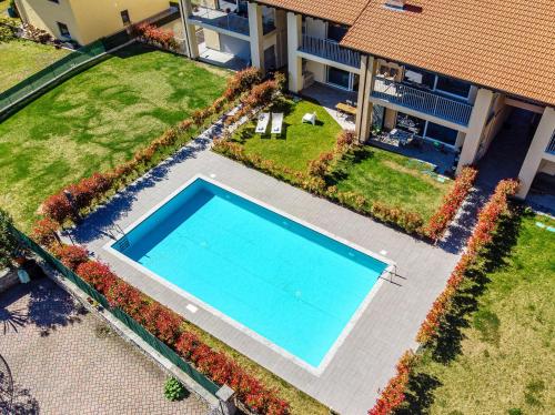 an overhead view of a swimming pool in front of a house at Silvia Lenno House - The House Of Travelers in Lenno