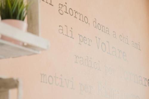 a wall with writing on it on a wall at Hotel Beverly in Rimini