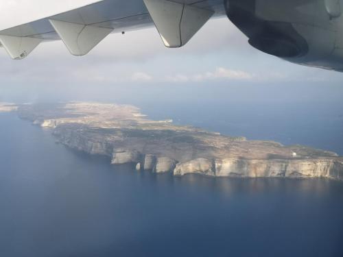 a view of a island in the water from an airplane at Casa alla Guitgia 2 in Lampedusa